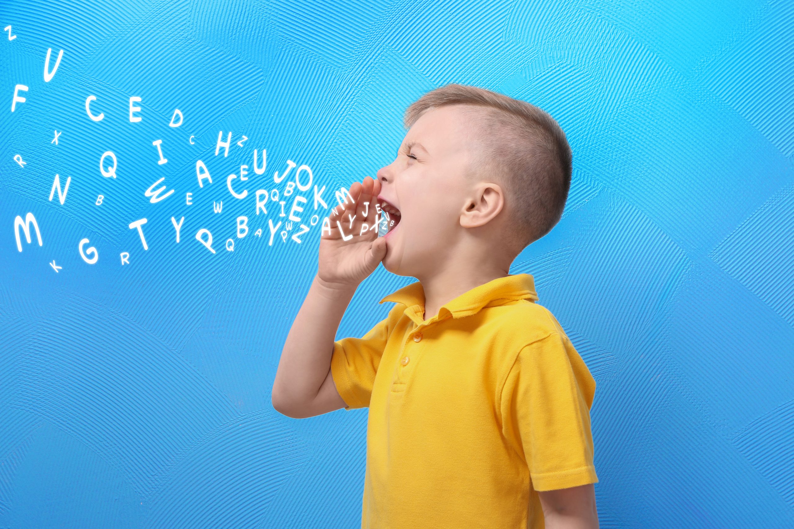 Little,Boy,And,Letters,On,Blue,Background.,Speech,Therapy,Concept Little,Boy,And,Letters,On,Blue,Background.,Speech,Therapy,Concept